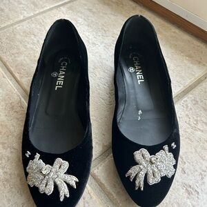 Authentic CHANEL Black and Silver Flats with Decorative Embellishments